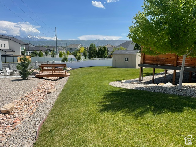 View of yard with a mountain view and a residential view