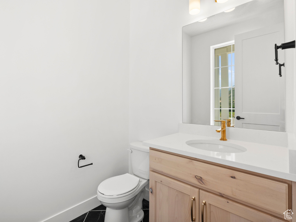 Bathroom featuring vanity and tile patterned floors