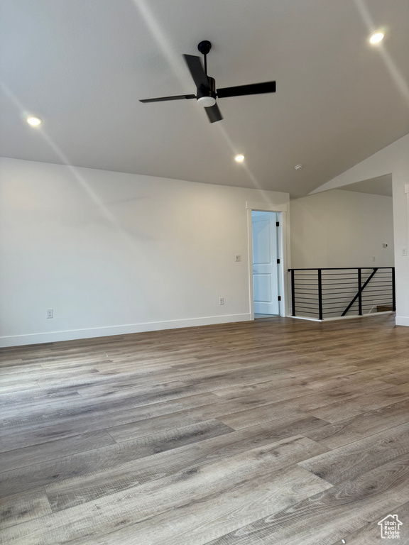 Spare room featuring a ceiling fan, baseboards, wood finished floors, and recessed lighting