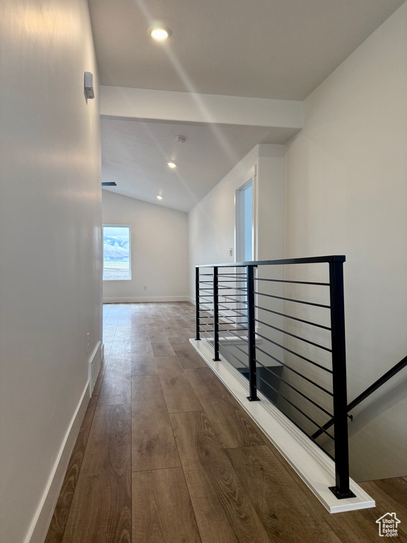 Hall featuring recessed lighting, wood finished floors, visible vents, an upstairs landing, and baseboards