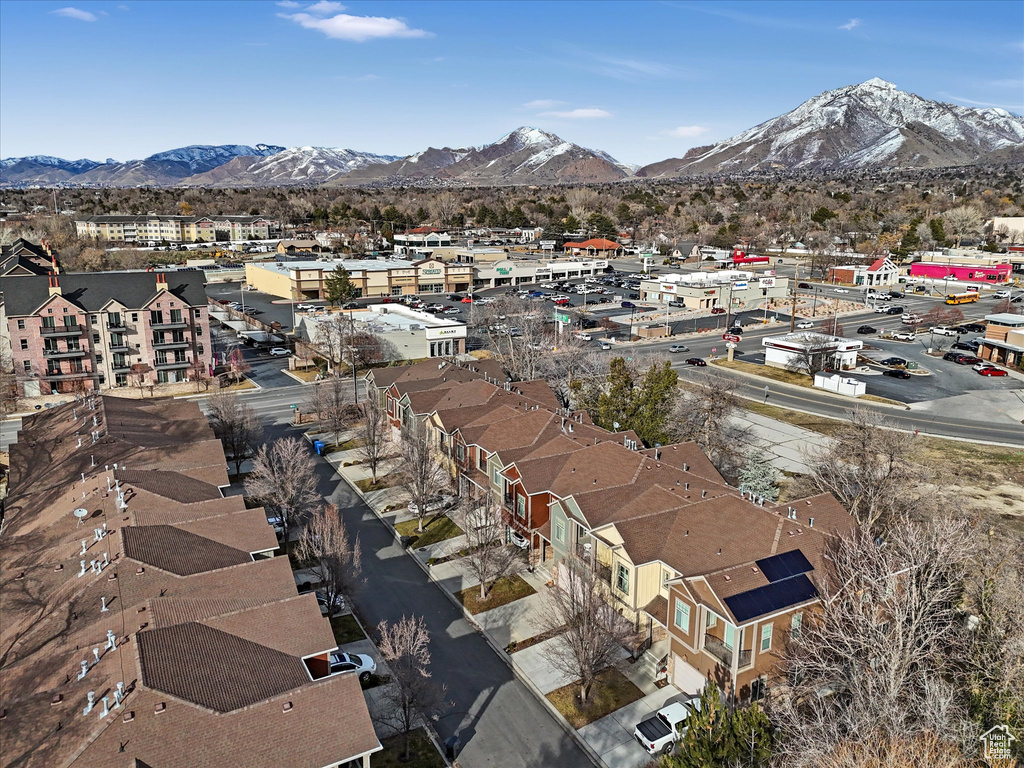 Birds eye view of property with a residential view and a mountain view