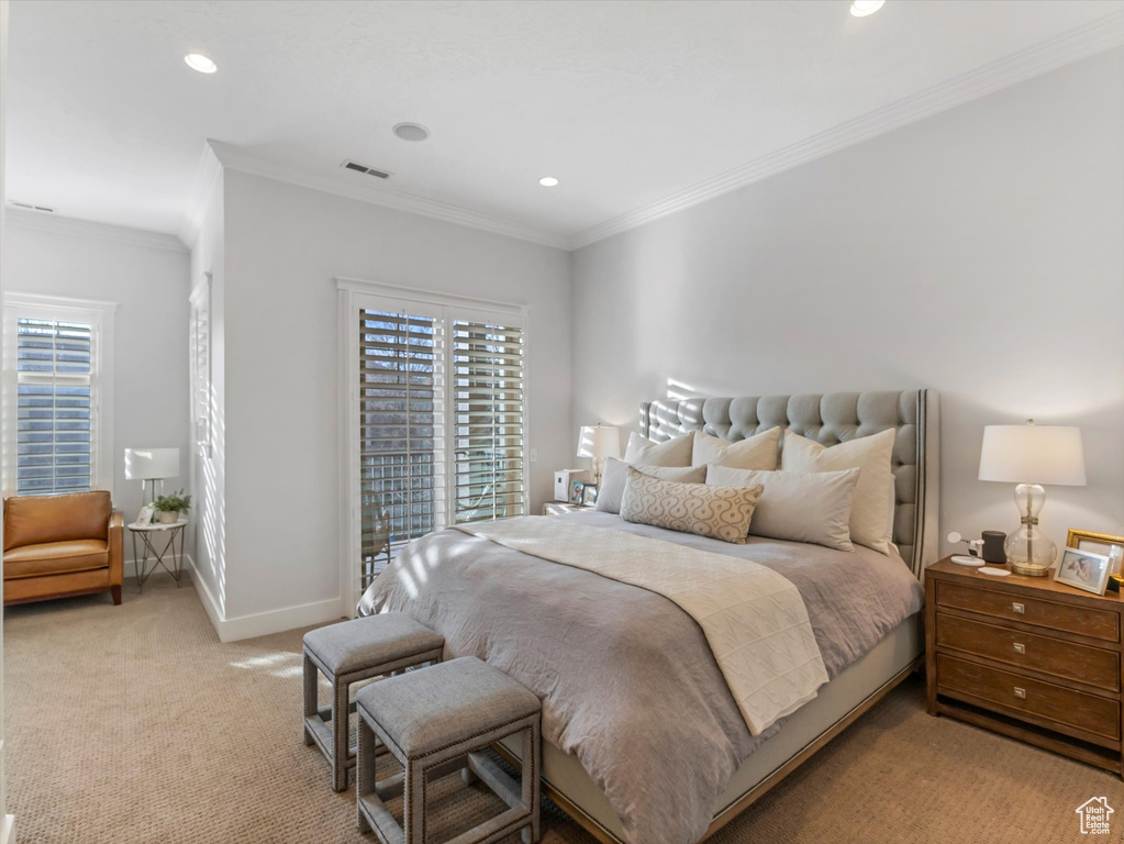 Bedroom with baseboards, visible vents, light colored carpet, crown molding, and recessed lighting