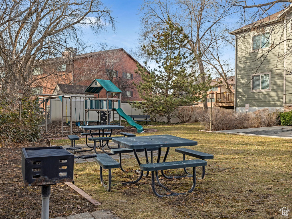 Surrounding community with a lawn and a playground