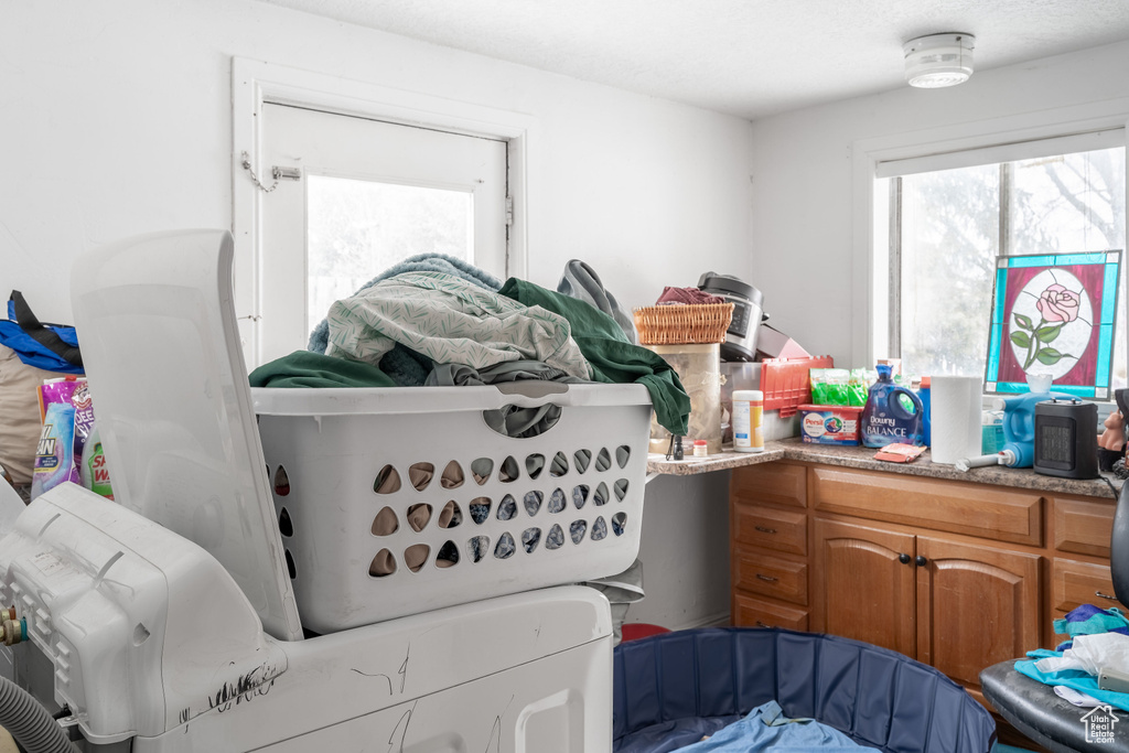 Clothes washing area featuring laundry area and washer and dryer