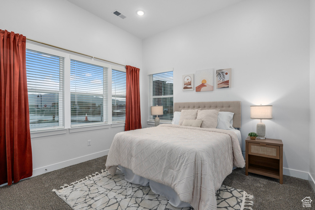 Bedroom featuring carpet, baseboards, visible vents, and recessed lighting