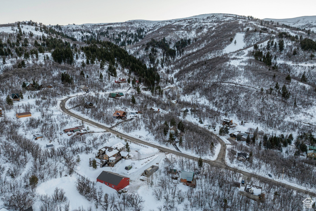 Snowy aerial view featuring a mountain view