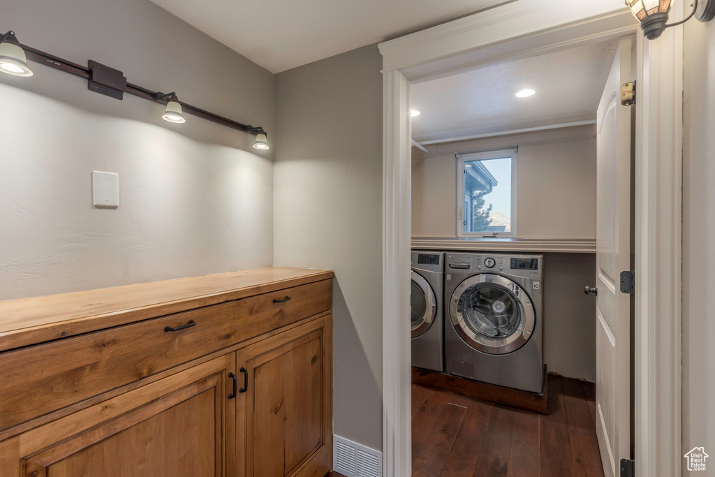 Washroom featuring laundry area, washer and dryer, baseboards, dark wood-style floors, and recessed lighting