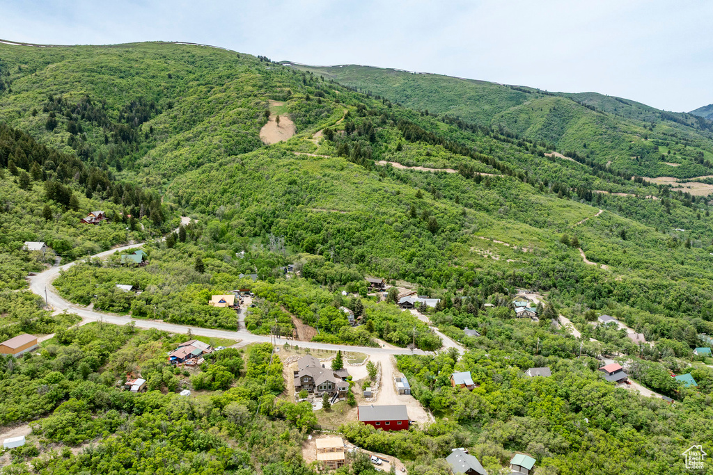 Bird's eye view of a heavily wooded area and mountains