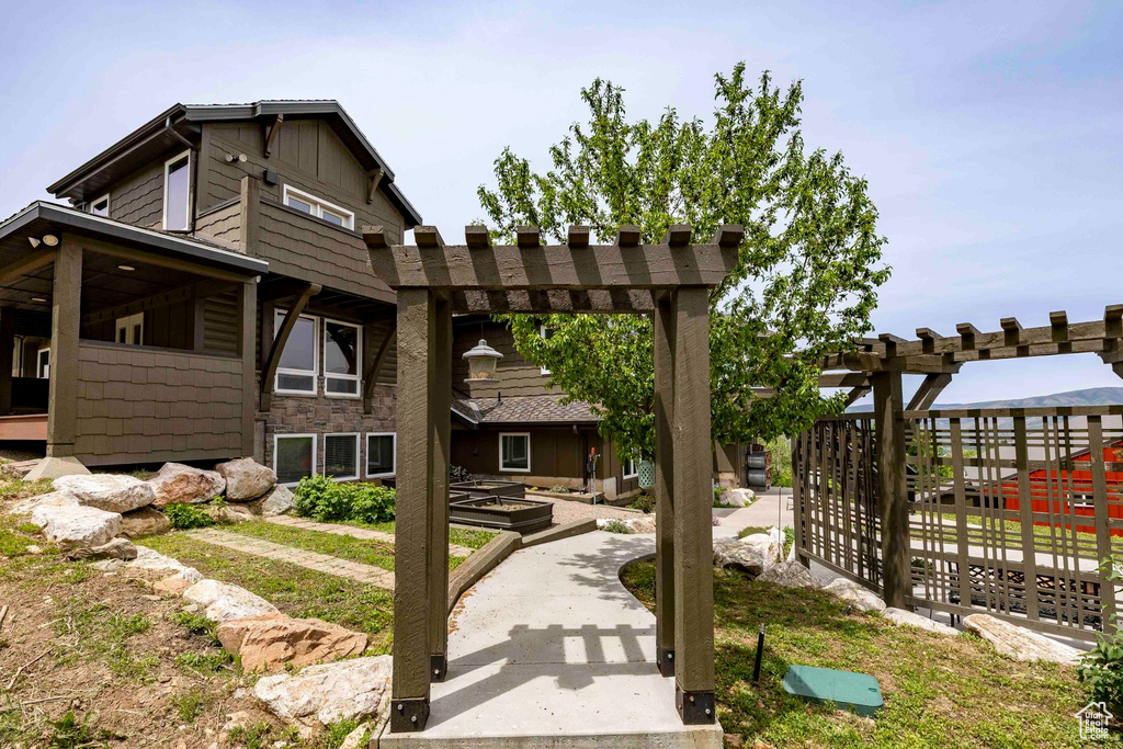 View of home's community with a pergola