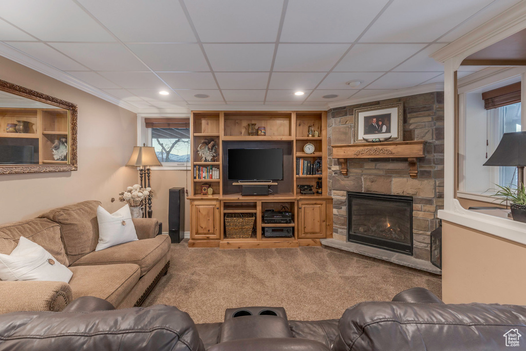 Living area featuring recessed lighting, a stone fireplace, and a paneled ceiling