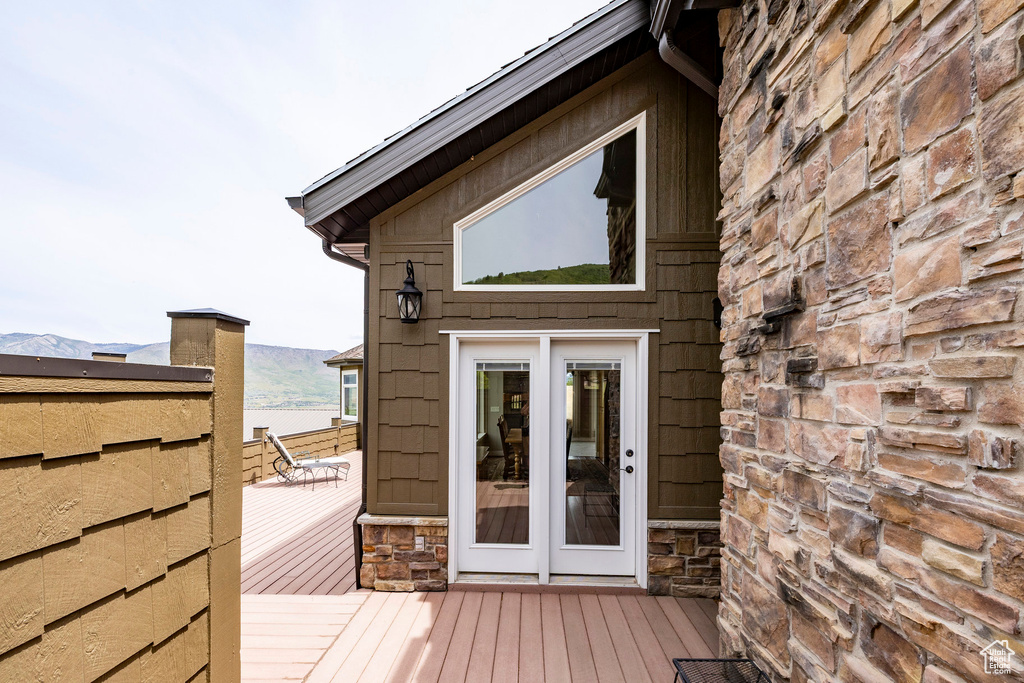 Wooden deck featuring french doors