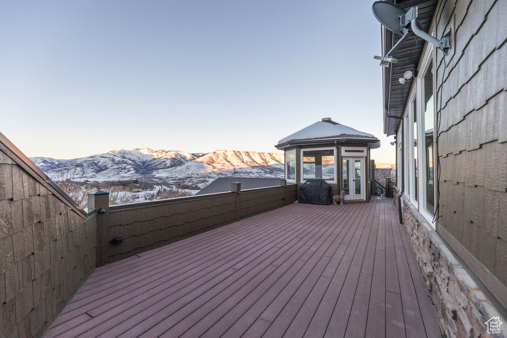 Deck featuring french doors and a mountain view