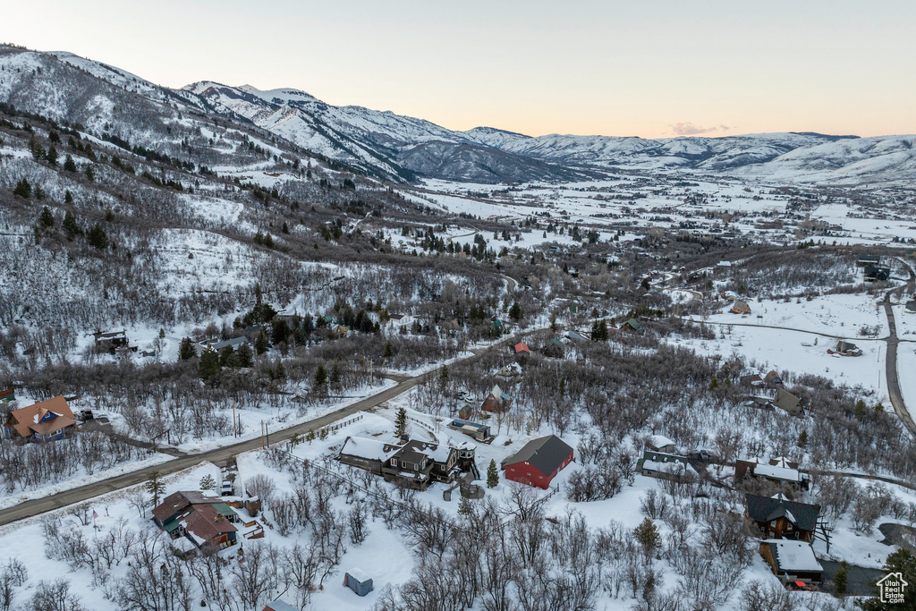 Snowy aerial view featuring a mountain view
