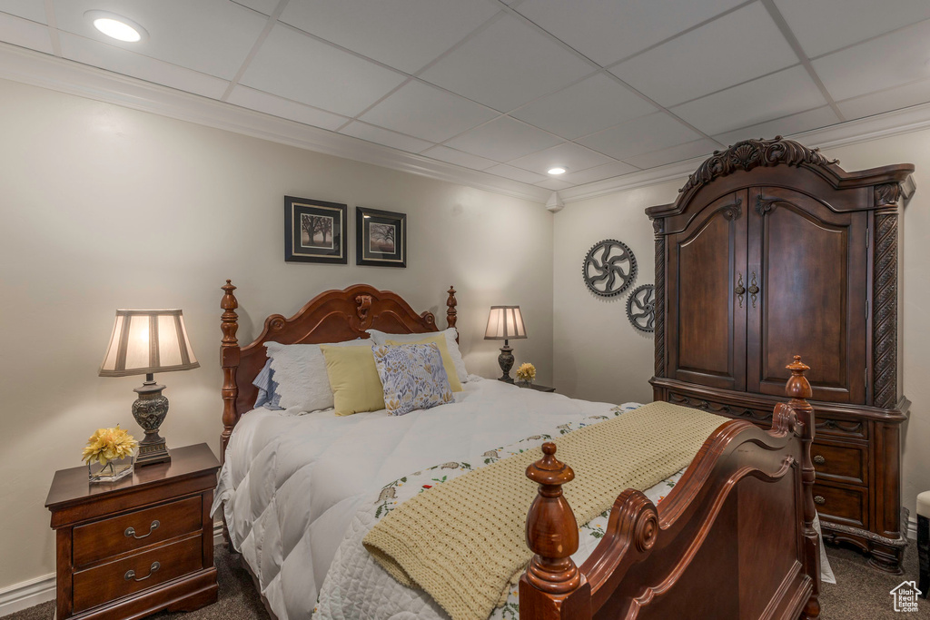 Carpeted bedroom featuring recessed lighting and a paneled ceiling