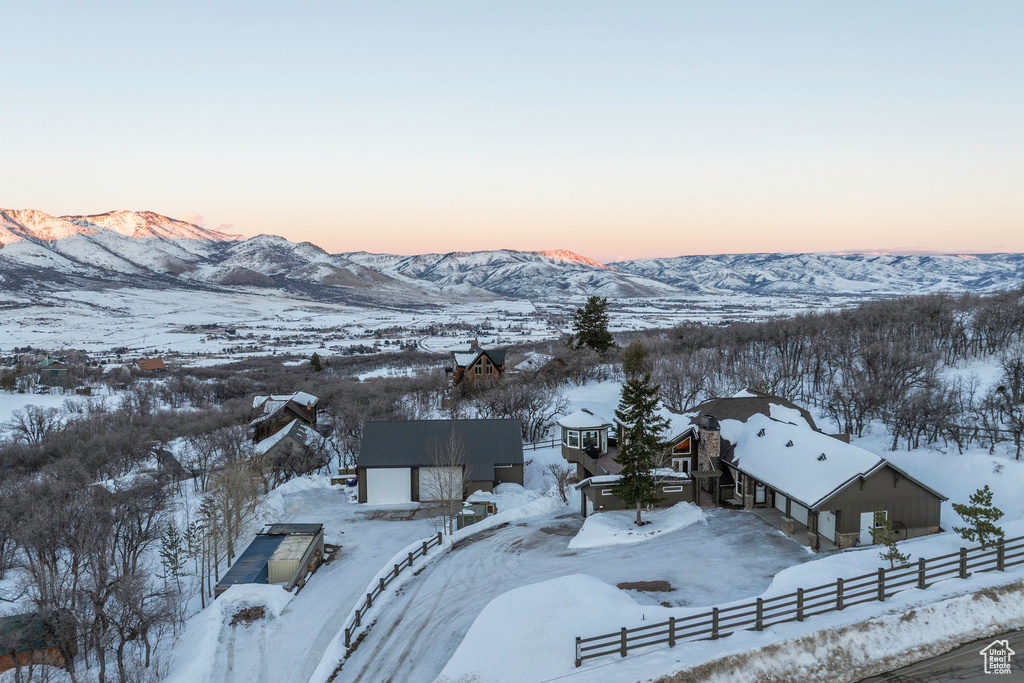 Snowy aerial view featuring a mountain view