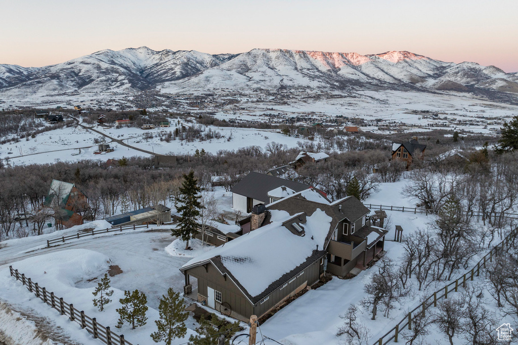 Snowy aerial view with a mountain view