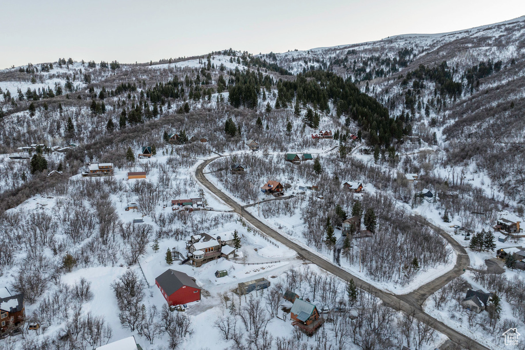 Snowy aerial view featuring a mountain view