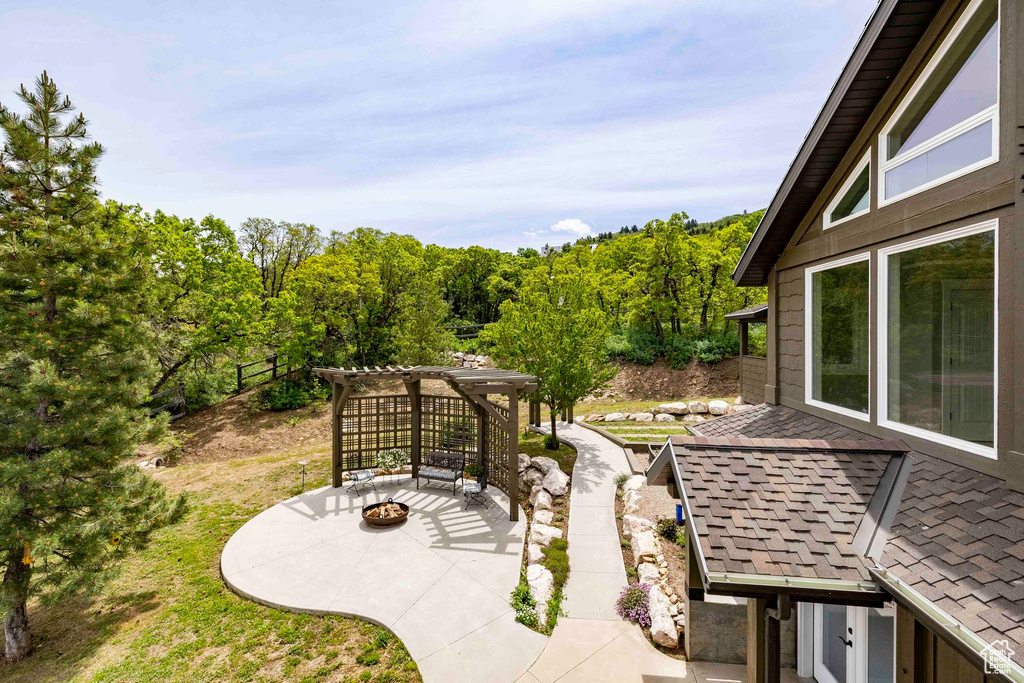 View of patio / terrace featuring a fire pit and a pergola