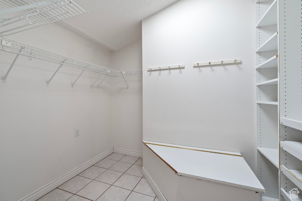 Spacious closet featuring light tile patterned floors