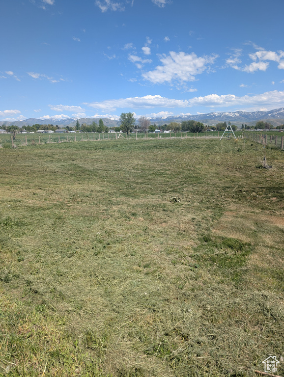View of undeveloped land featuring rural landscape and mountains