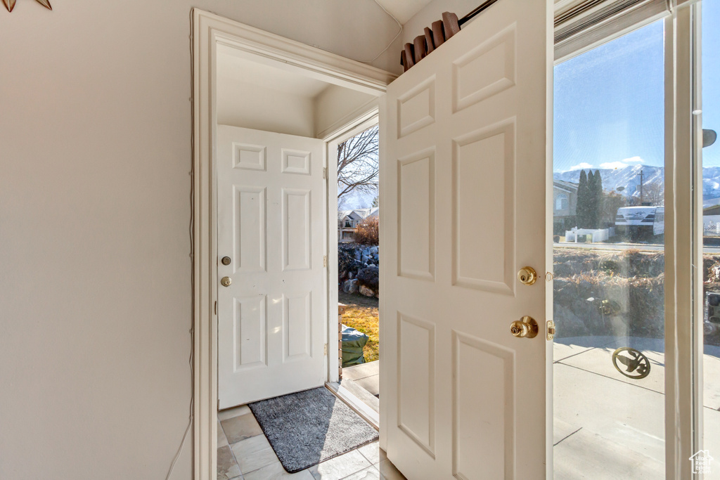 Doorway to outside featuring a mountain view