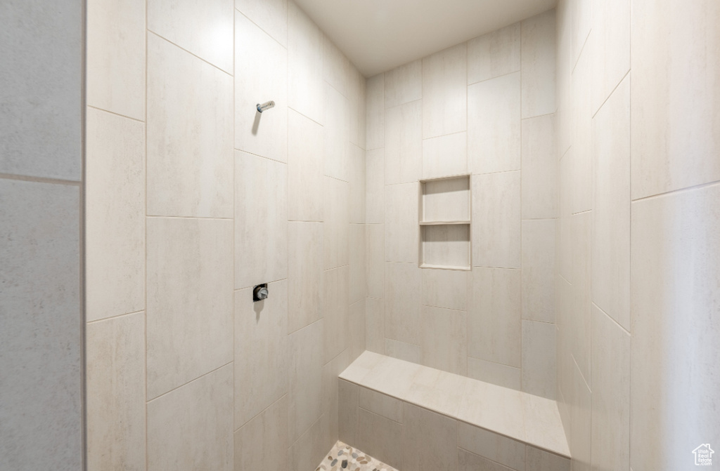 Full bath with a tile shower