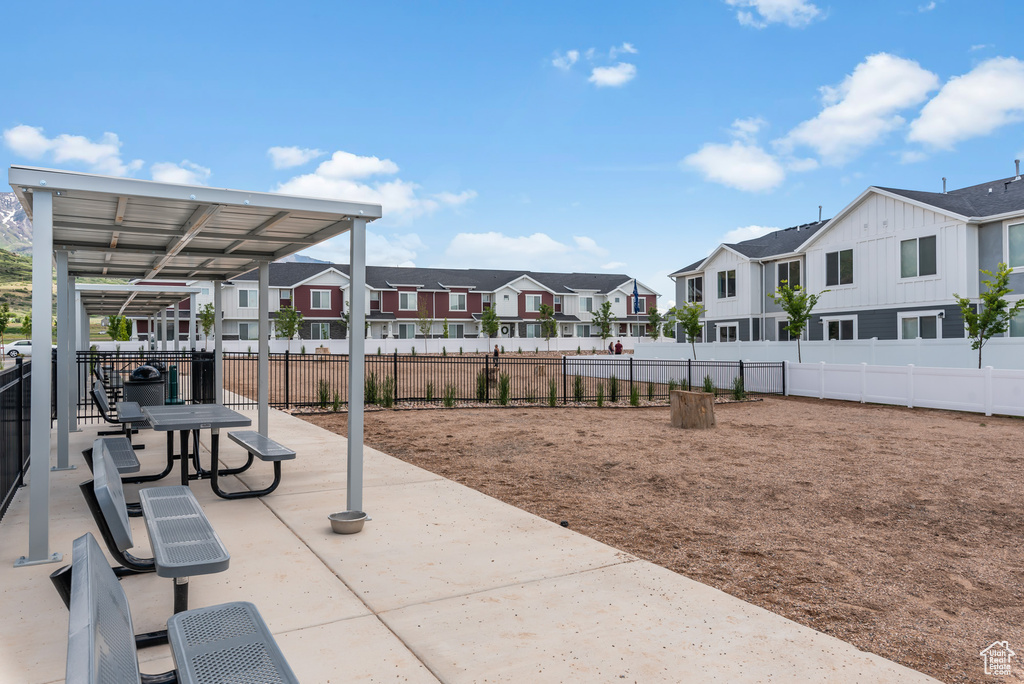 View of patio / terrace featuring a residential view and fence