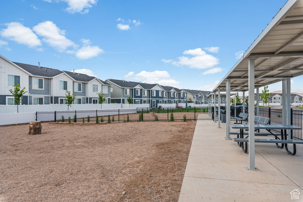View of property\'s community featuring a residential view and fence