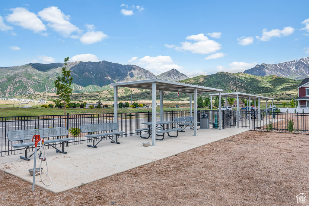 View of community with fence and a mountain view