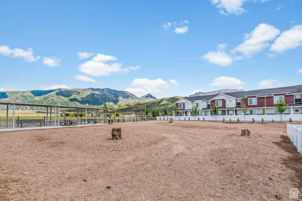 Exterior space with fence and a mountain view