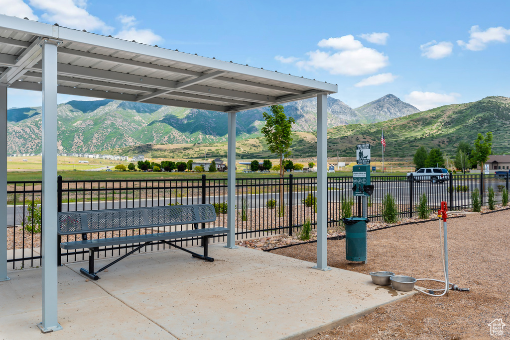 View of community with fence and a mountain view