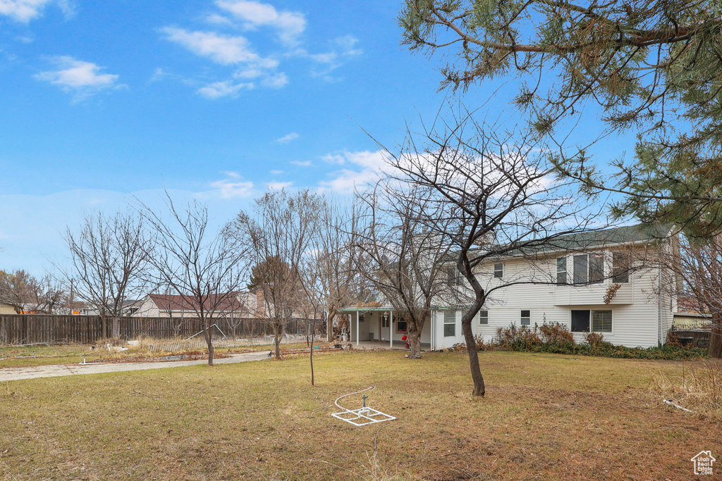 View of yard featuring fence