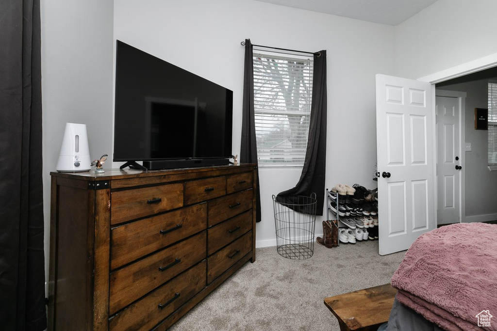 Carpeted bedroom with baseboards