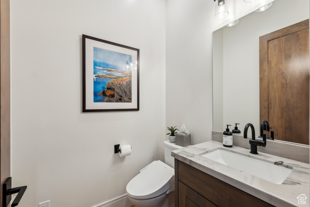 Bathroom with vanity and toilet