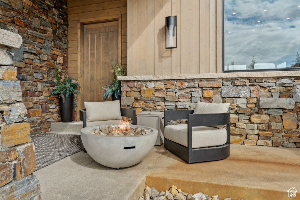 Detailed view of stone siding and a fire pit
