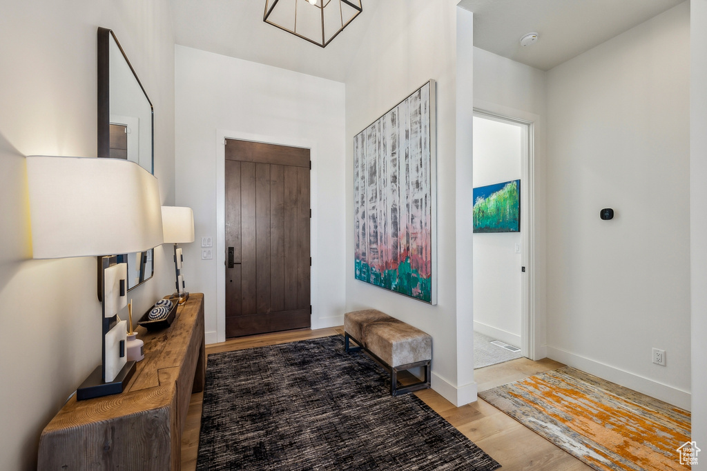 Entryway featuring wood finished floors and baseboards
