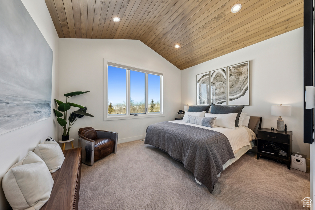 Carpeted bedroom with lofted ceiling, wooden ceiling, and recessed lighting