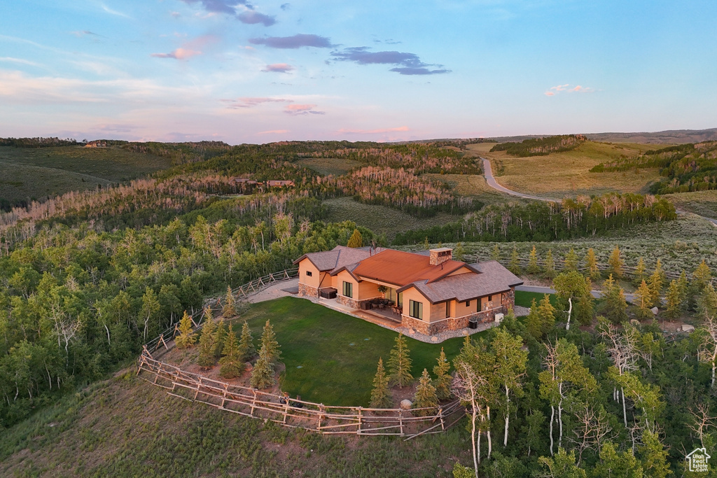 Overview of rural landscape featuring a heavily wooded area