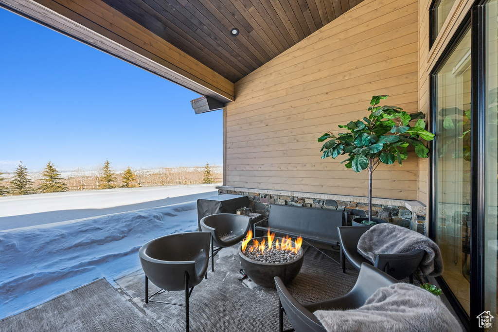 View of patio / terrace with a fire pit