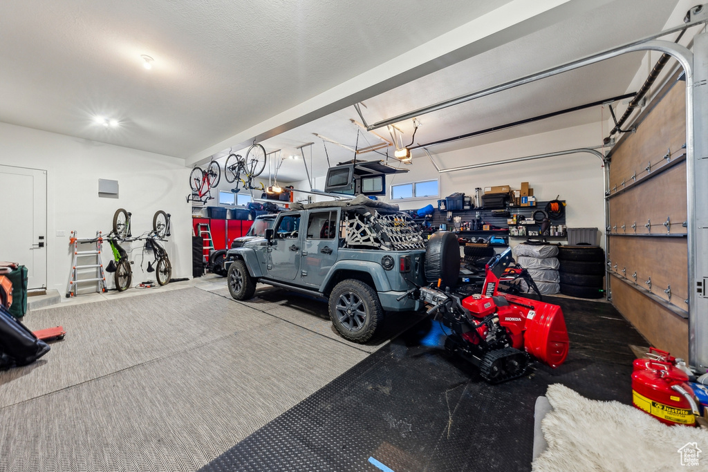 Garage featuring a garage door opener