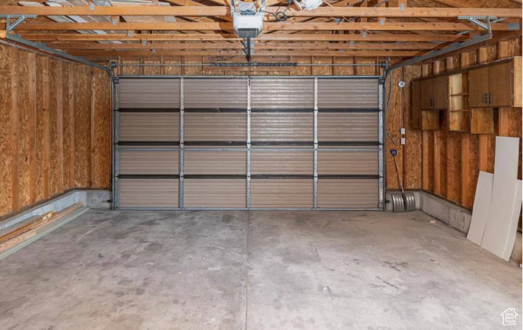 Garage featuring a garage door opener