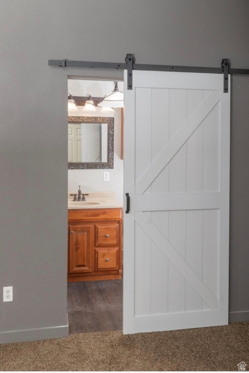 Bathroom with vanity and baseboards