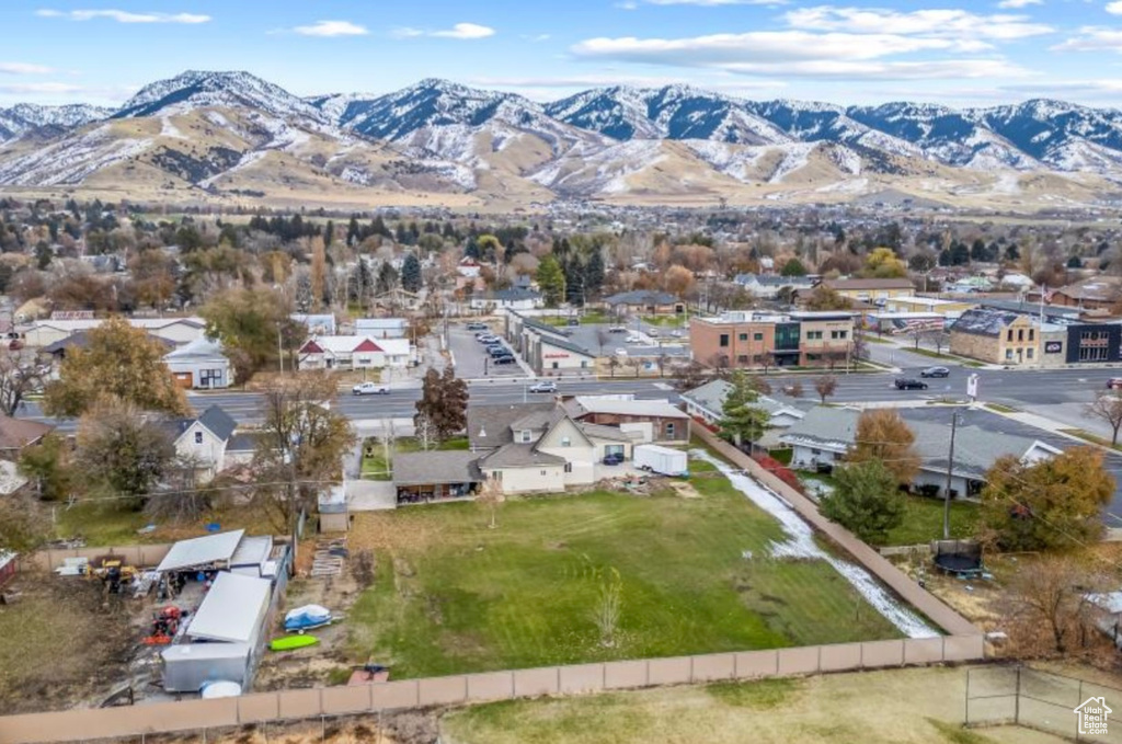 Birds eye view of property with a residential view and a mountain view