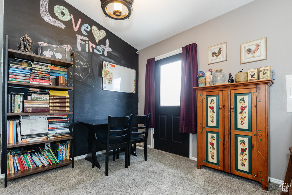 Office area with baseboards and carpet flooring