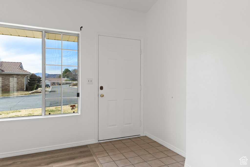 Foyer entrance with baseboards