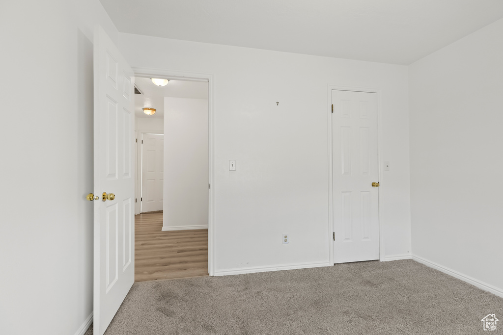 Interior space with carpet and baseboards