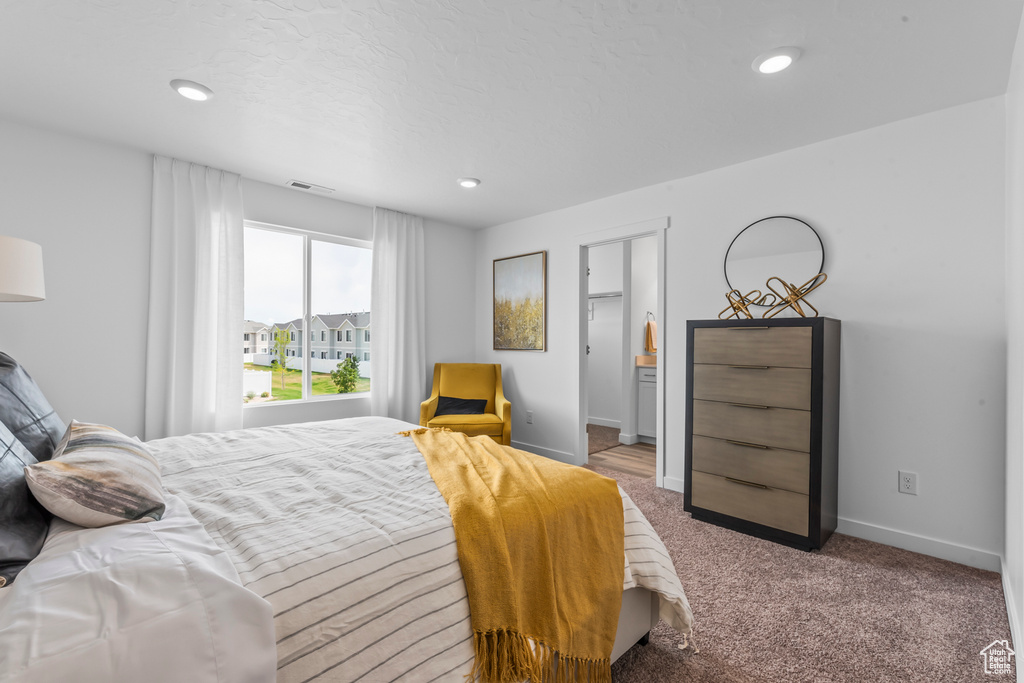 Bedroom featuring carpet, visible vents, baseboards, and recessed lighting