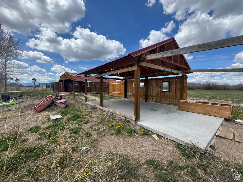 View of patio featuring an outdoor structure