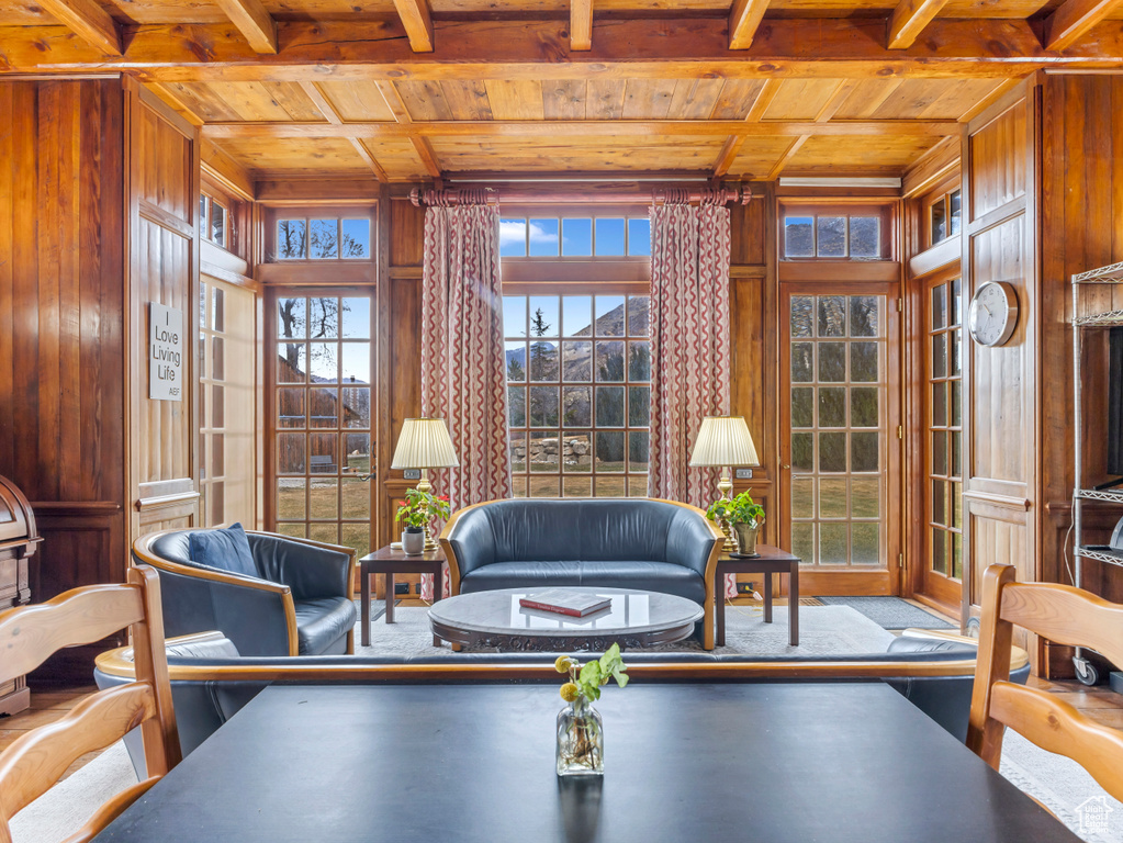 Sunroom / solarium featuring beam ceiling