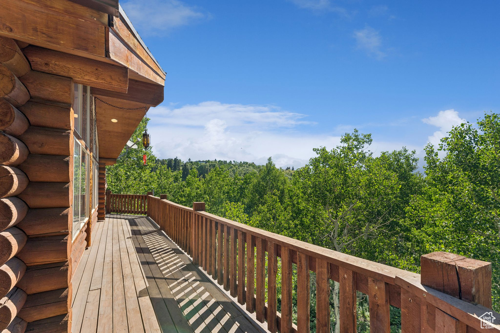 Deck featuring a wooded view